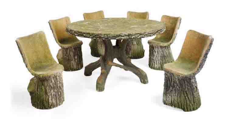 A SET OF SIX COMPOSITE-STONE GARDEN CHAIRS AND A MATCHING TABLE , 20TH